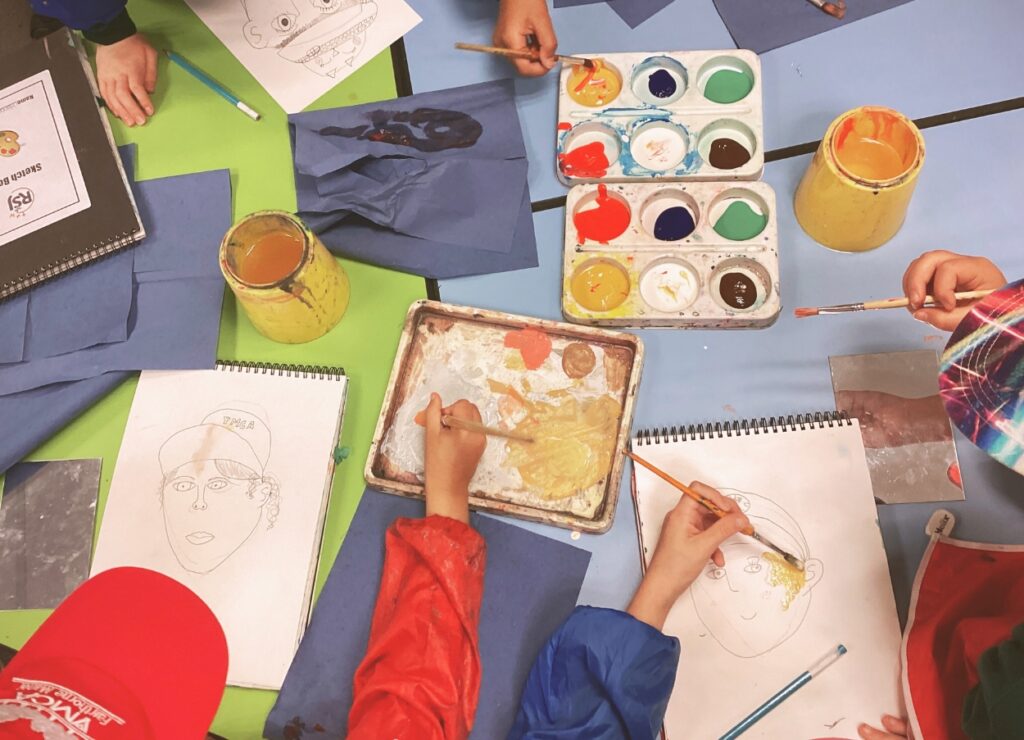 Children working together on a collaborative art project